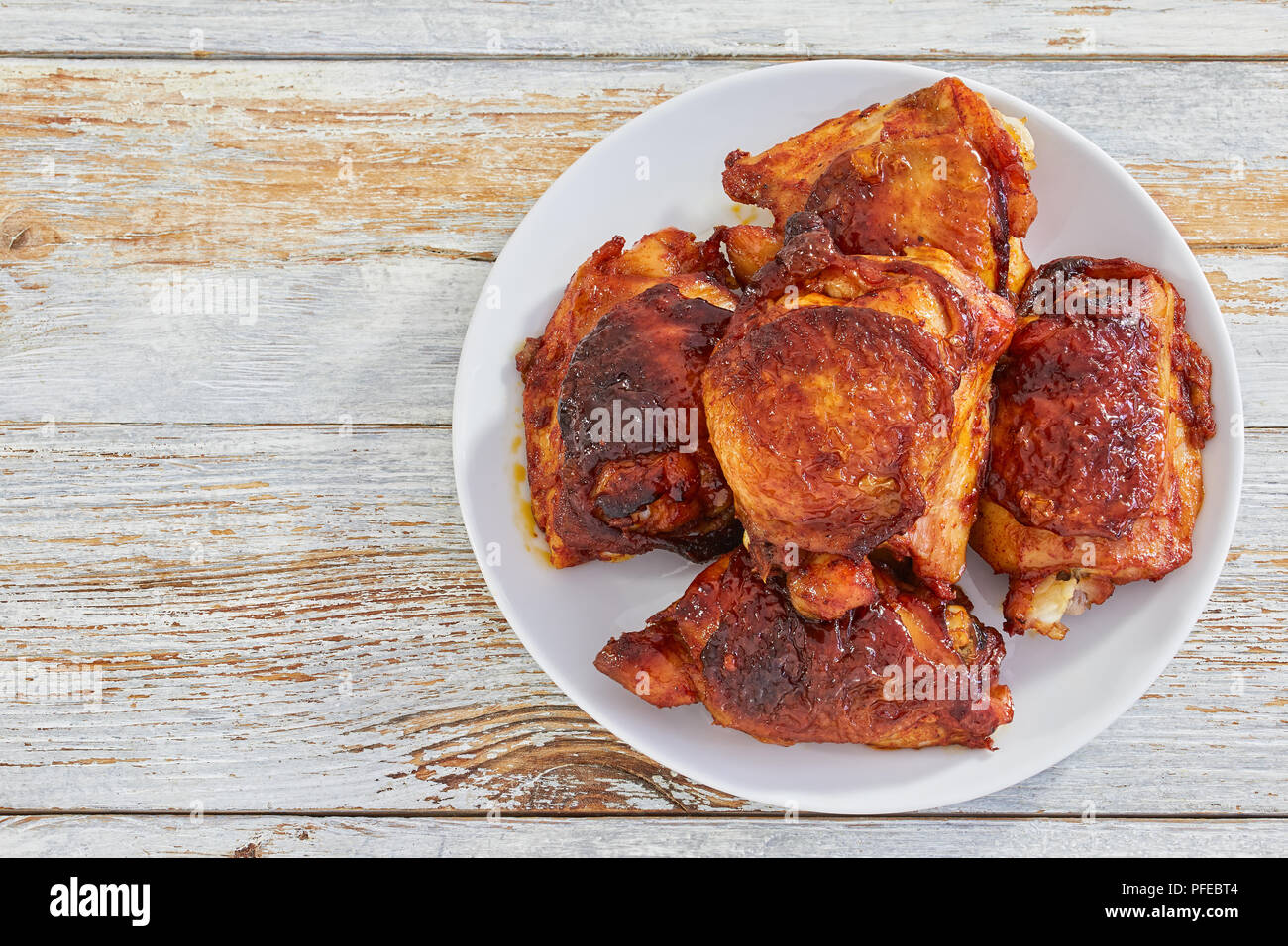 delicious fried chicken thigh marinated in mixture of honey, soy and