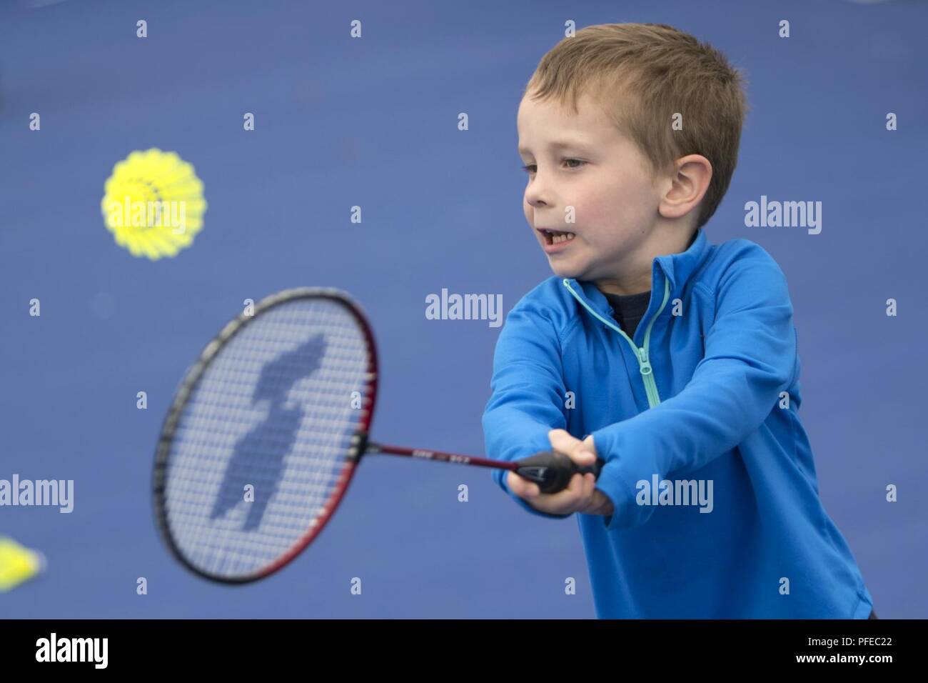 Jackson Brockhoff, 5, plays badminton during an exhibition day for families during the 2018 games at the Air Force Academy in Colorado Springs, Colo. June 3, 2018. Stock Photo