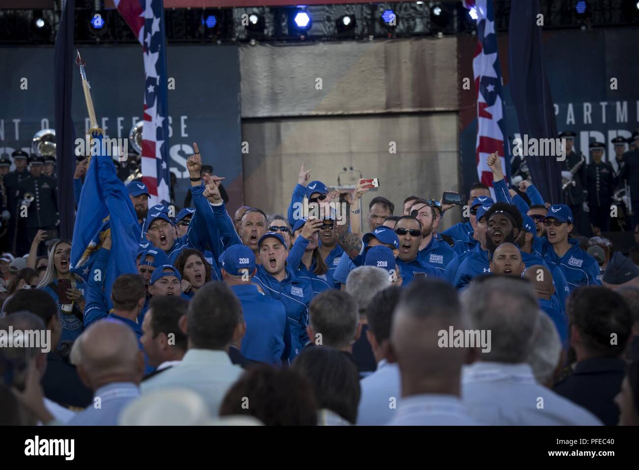 Team Air Force celebrates after walking into the opening ceremony of the Department of Defense Warrior Games in Colorado Springs, Colorado, June 2, 2018. First held in Colorado Springs in 2010, the Warrior Games were established as a way to enhance the recovery and rehabilitation of wounded, ill, and injured service members and expose them to adaptive sports. This year, the Games have returned to Colorado Springs, with the Air Force as the host service. Stock Photo