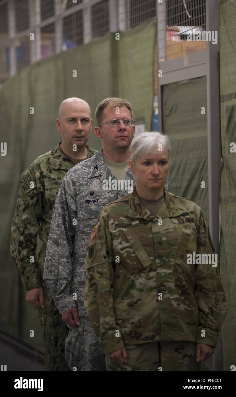 U.S. Army Brig. Gen. Laura Potter (right), Headquarters European Command Director of Intelligence, officiates the change of command of U.S. Air Force Colonel Parker Wright (centre), former Commander of the Joint Intelligence Operations Center Europe (JIOCEUR) Analytic Center, and U.S. Navy Captain Robert Hight Jr. (left),during the JIOCEUR Analytic Center change of command ceremony at RAF Molesworth, England on June 1, 2018. U.S. Navy Captain Robert Hight Jr. assumed Commander of the JIOCEUR Analytic Center. Stock Photo