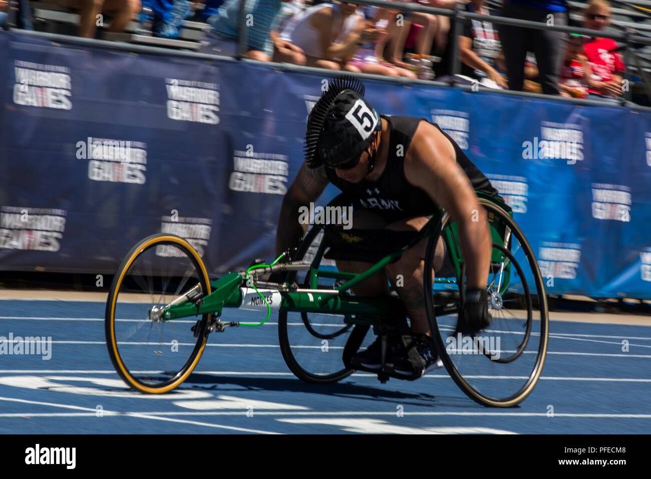 U.S. Army Staff Sgt. Chris Montes, a Team Army competitor, competes in track at the United States Air Force Academy, Colorado Springs, Colorado, June 2, 2018. The DoD Warrior Games is an adaptive sports competition for wounded, ill, and injured service members and veterans. Approximately 300 athletes representing teams from the Army, Navy, Air Force, Special Operations Command, United Kingdom Armed Forces, Canadian Armed Forces, and the Australian Defence Force will compete June 1 - June 9 in archery, cycling, track, field,shooting, sitting volleyball, swimming, wheelchair basketball, and - ne Stock Photo