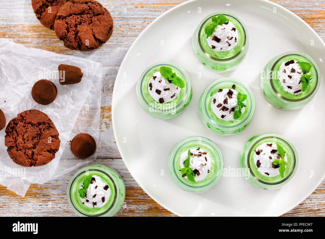 portions of mint Cheesecake Mousse topped with whipped cream, chocolate