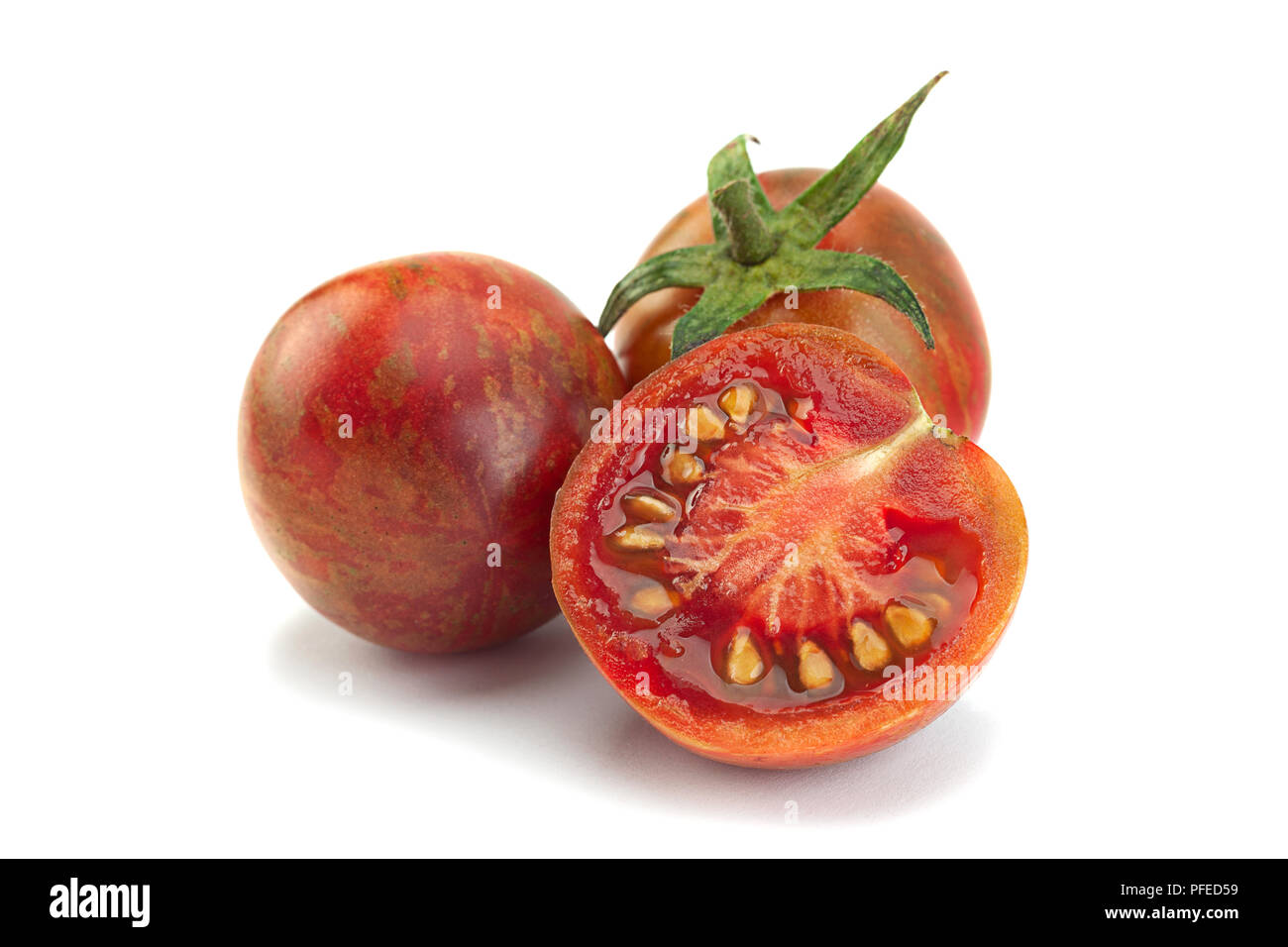 Brown cherry tomatoes colseup isolated on white background Stock Photo ...