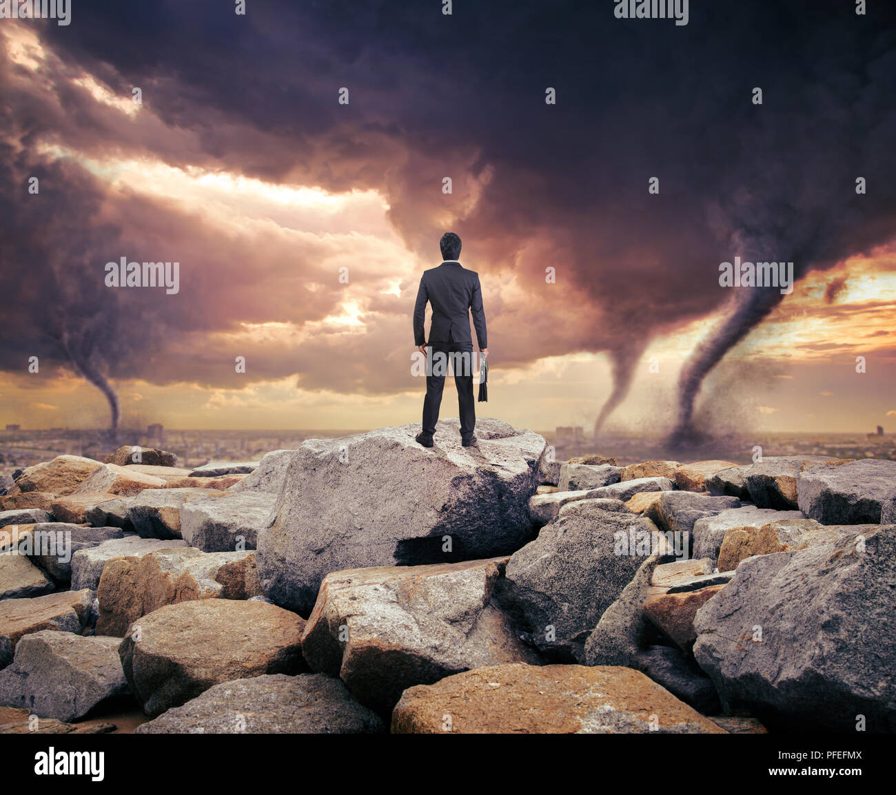 Businessman watching a tornado. Concept for success. Stock Photo