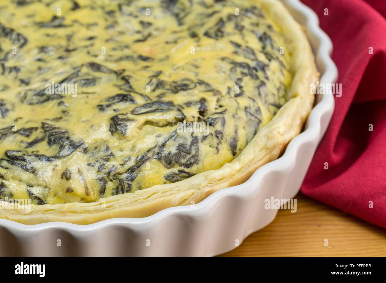 Spinach, eggs, feta tart very close up Spinach quiche background with