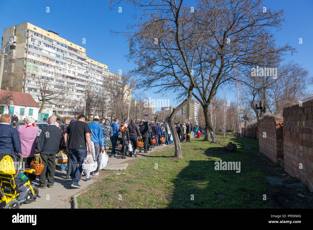 DNEPR, UKRAINE, APRIL 08, 2018: Easter, Bright Resurrection of Christ. People are standing in front of the entrance to the Holy Monastery of Tikhvin Stock Photo