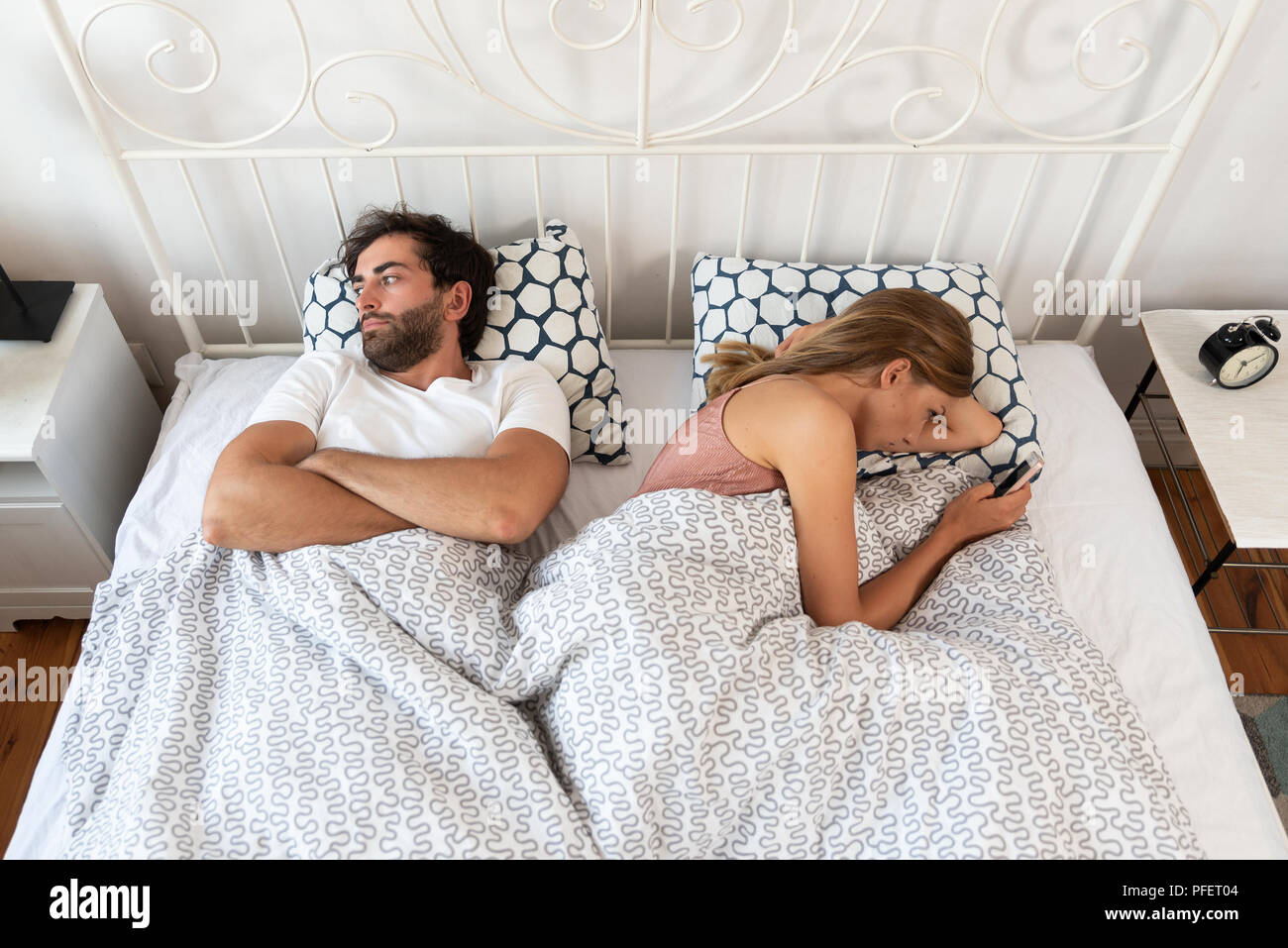 Couple bored with each other. Bad relations in a relationship. Stock Photo