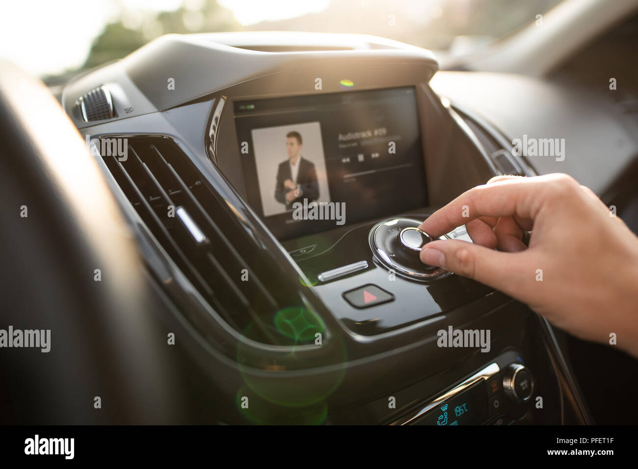 Man using car multimedia audio system. Internet car radio with touchscreen Stock Photo