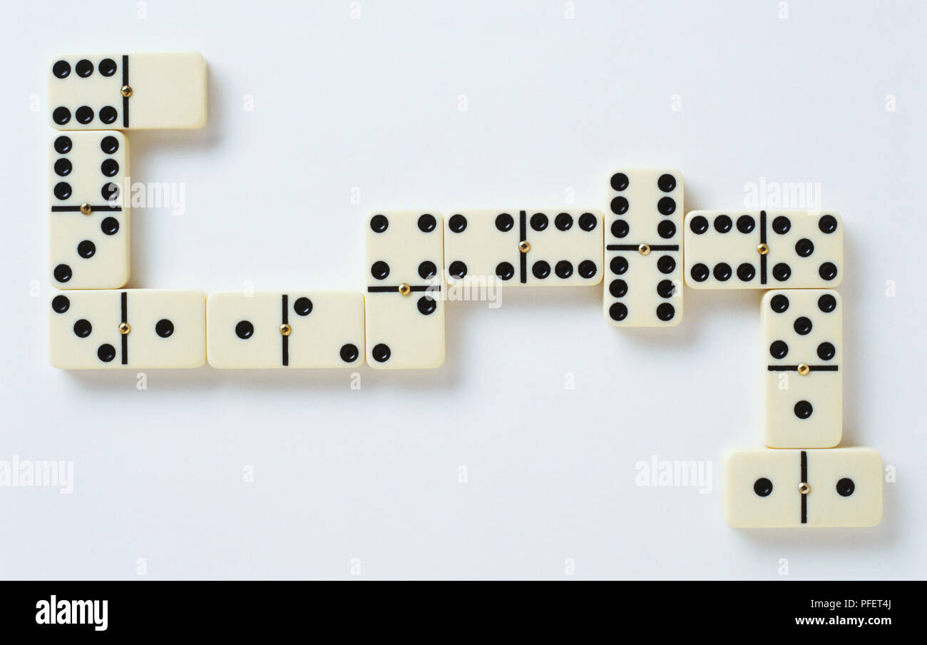 Domino tiles laid out in shape of a snake, close up Stock Photo