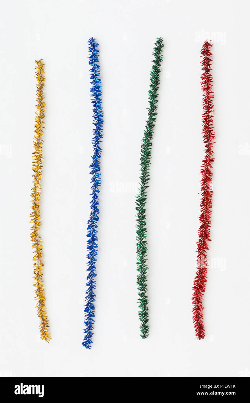 Four strips of different coloured tinsel Stock Photo Alamy