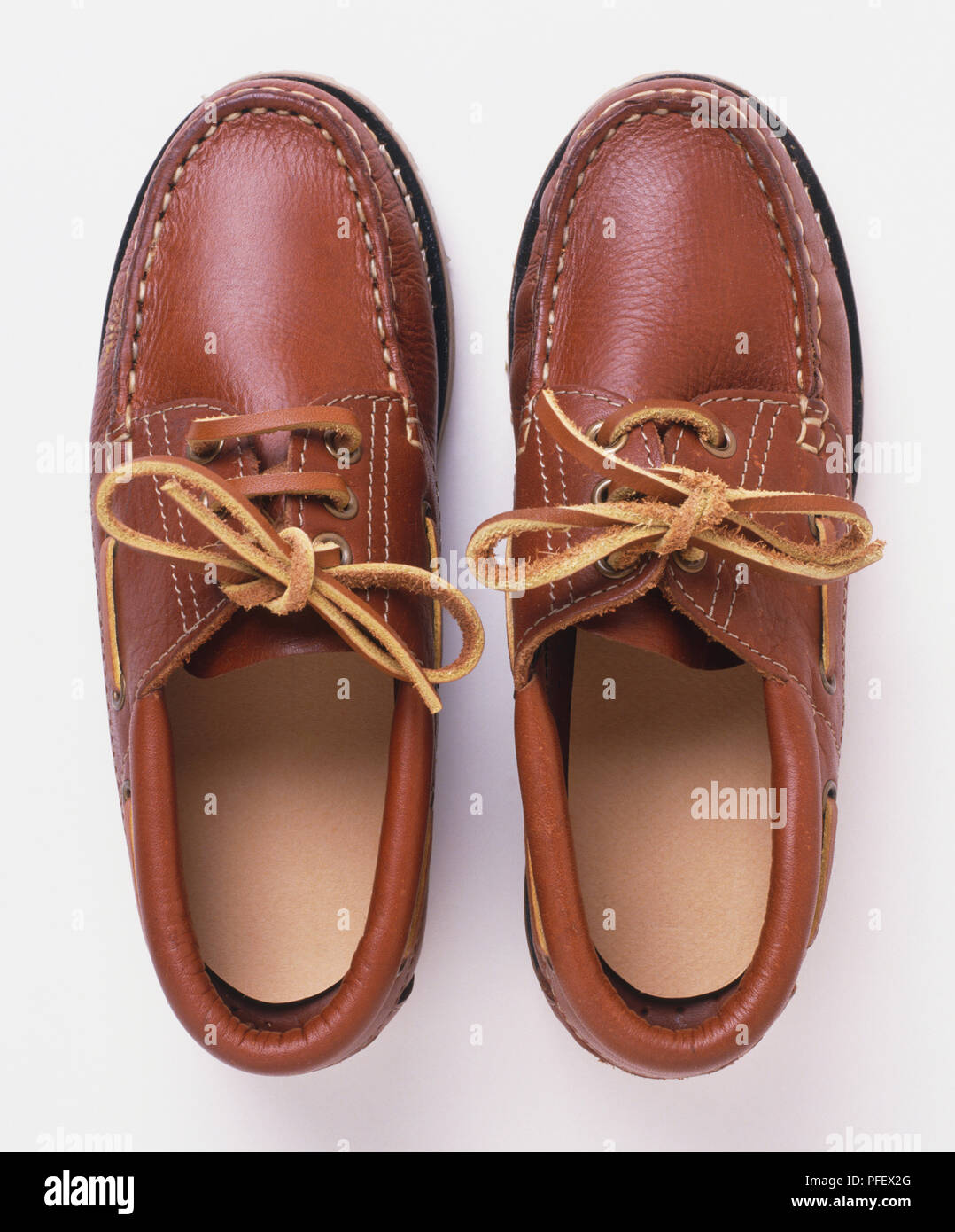 Pair of men's brown leather shoes with matching leather laces, view from  above Stock Photo - Alamy