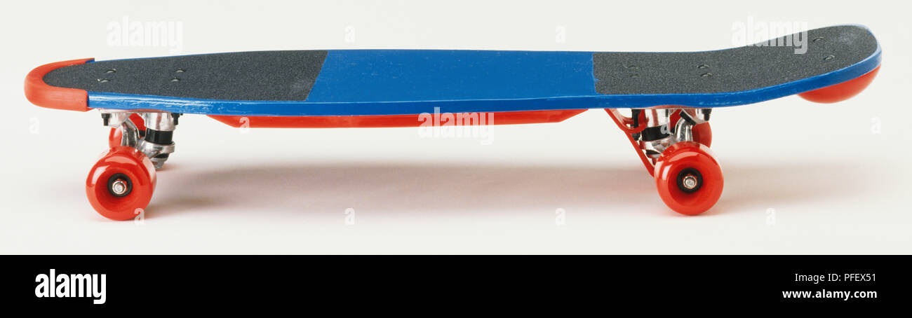 Blue skateboard with red plastic wheels and nose and tail guards, side view  Stock Photo - Alamy