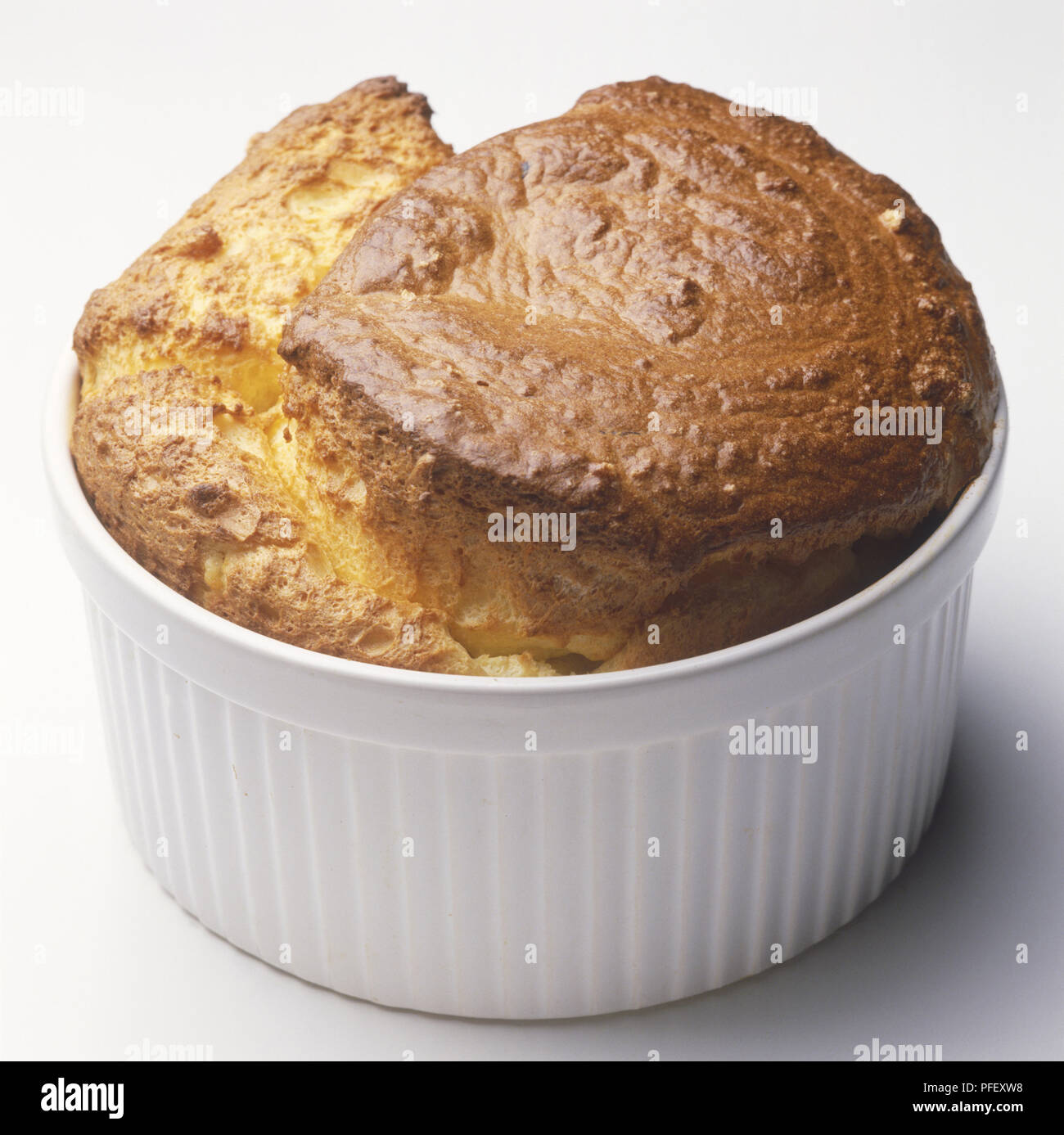 Golden brown souffle in a ramekin Stock Photo Alamy