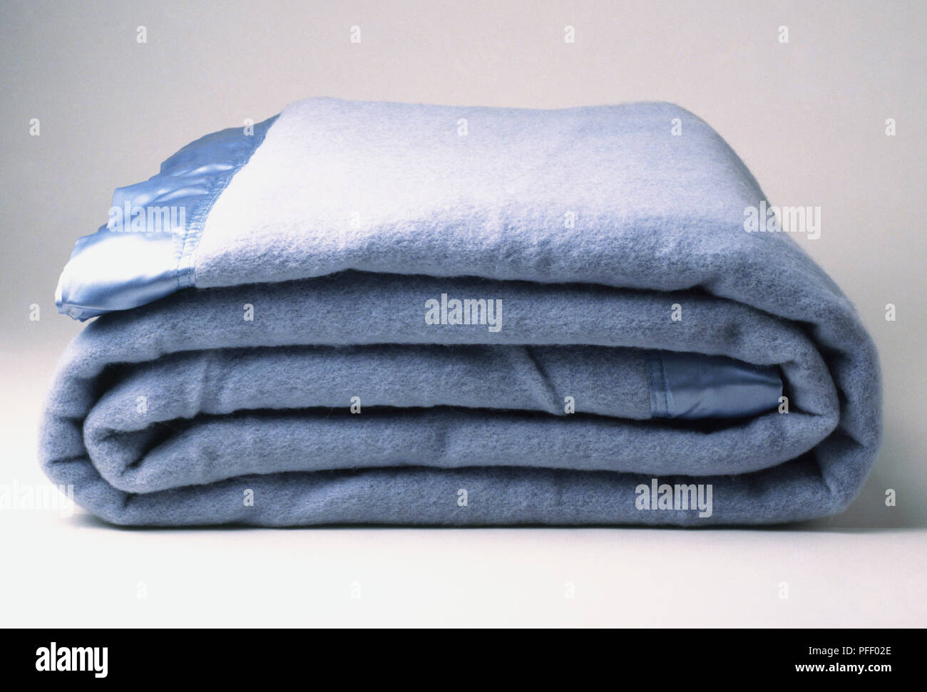 A blue blanket, folded Stock Photo