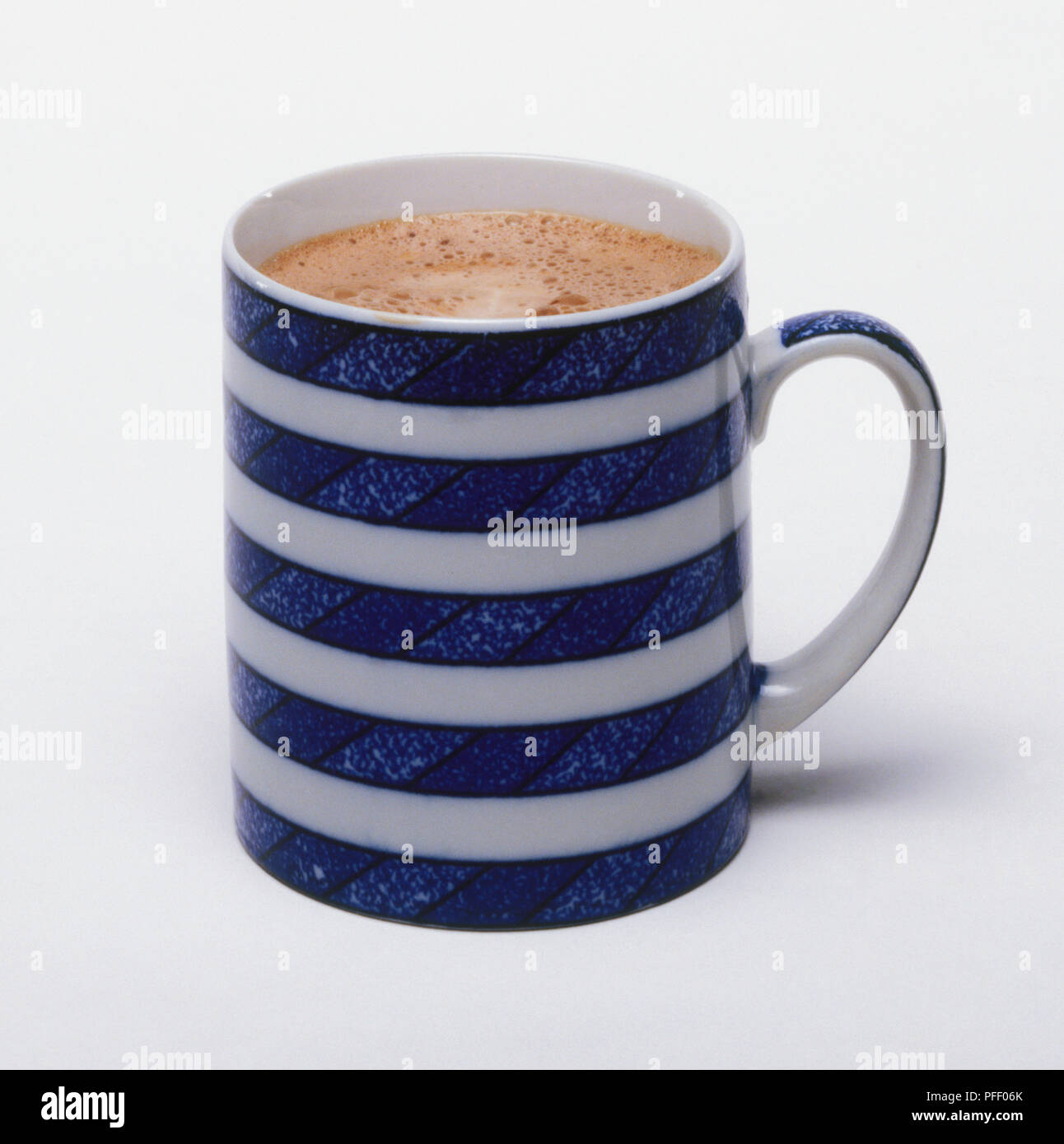 Hot chocolate in blue and white striped mug Stock Photo