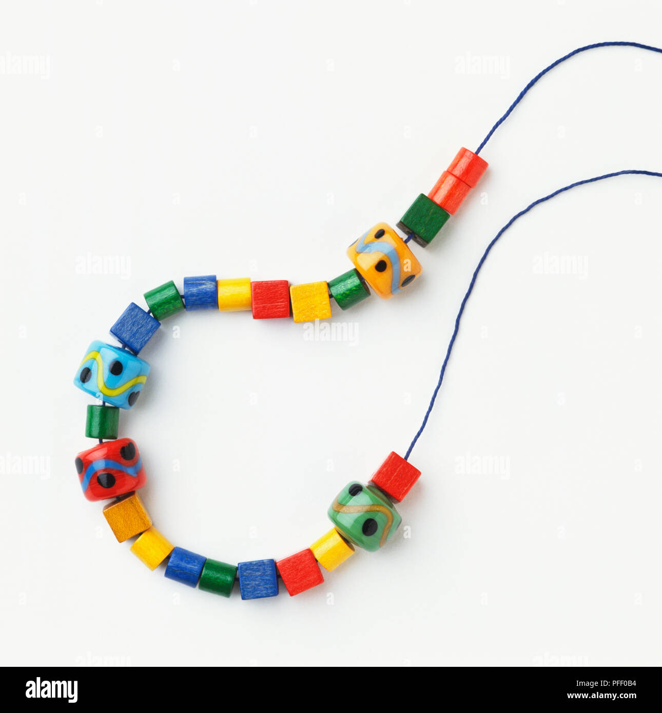 Wooden Beads On A String Making A Colorful Toy Necklace Stock Photo,  Picture and Royalty Free Image. Image 26229227.
