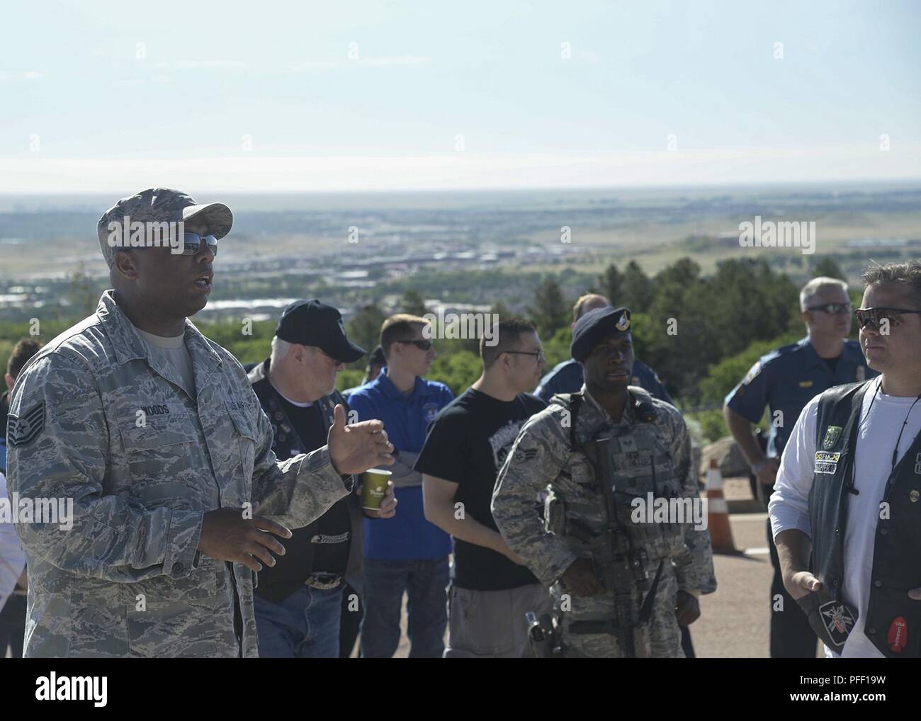 CHEYENNE MOUNTAIN AIR FORCE STATION, Colo.—Tech. Sgt. Wade H. Woods II, 21st Space Wing Non-Commissioned Officer In Charge of occupational safety, gives a safety brief before the Fallen Officers Memorial Motorcycle Ride, June 1, 2018 at Cheyenne Mountain Air Force Station, Colorado. The ride began in 2014 with only 12 riders. Four years and five rides years later, 137 riders attended to honor fallen military and civilian police officers. Stock Photo