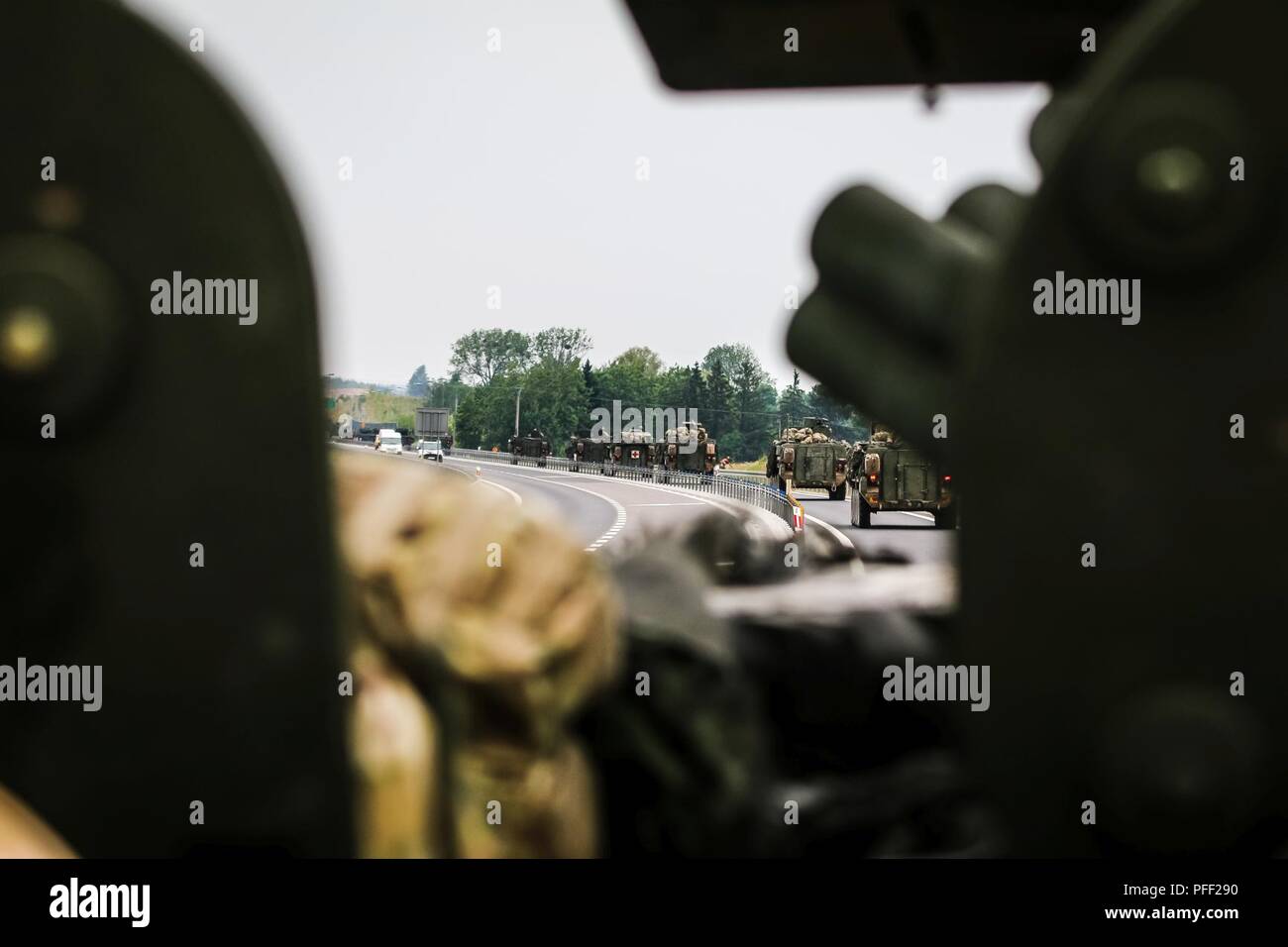A convoy of a Interim Armored Vehicles 'Strykers” move to begin a multinational quick response exercise, Bull Run 5.5, with Battle Group Poland at Olecko, Poland on June 11, 2018 as part of Saber Strike 18. This year's exercise, which runs from June 3-15, tests allies and partners from 19 countries on their ability work together to deter aggression in the region and improve each unit's ability to perform their designated mission. Stock Photo