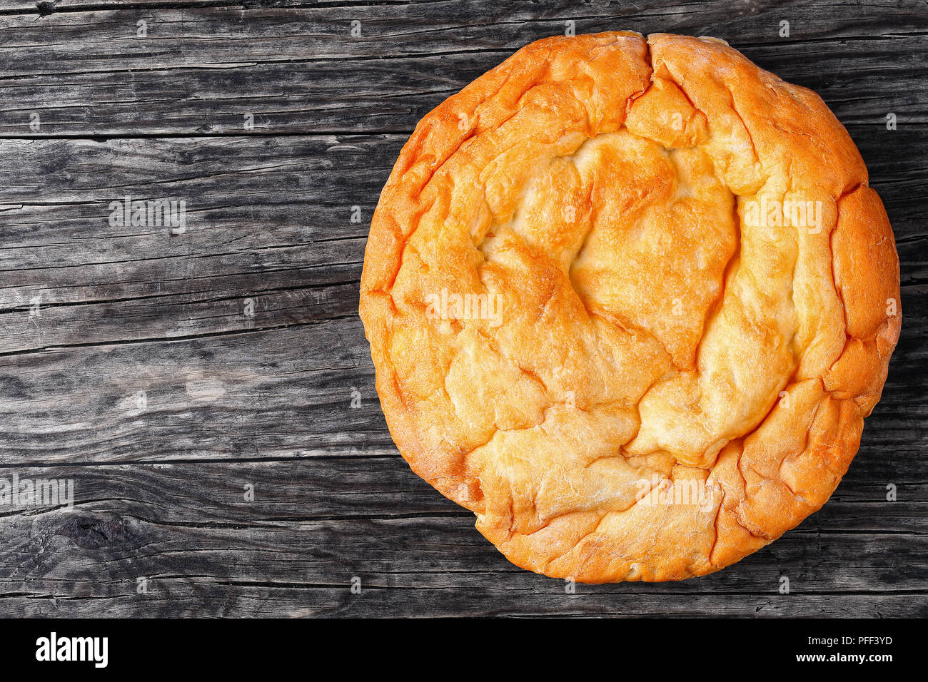 Pita, Arabic bread, soft baked flatbreads on wooden table, view from above Stock Photo