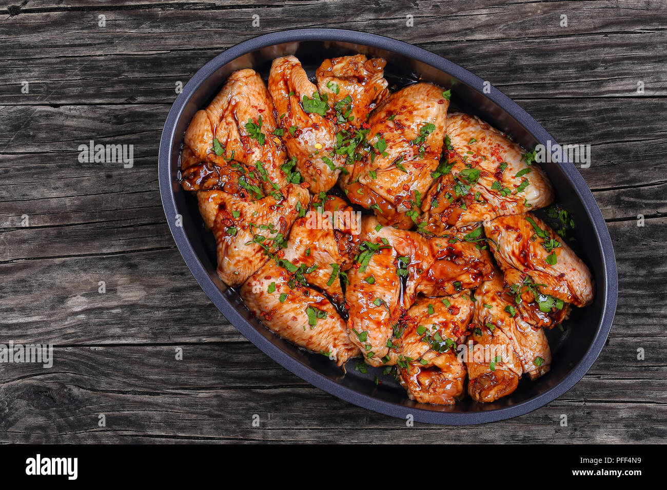 raw chicken wings marinated with honey, soy sauce, cayenne pepper and