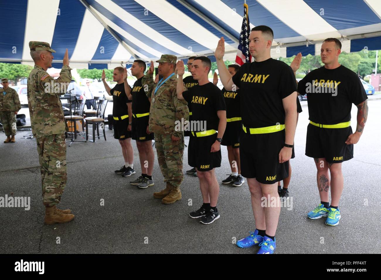 Ten Soldiers take the Army's oath of enlistment with Maj. Gen. James F. Pasquarette, commanding general of USARJ, during a mass reenlistment ceremony held June 13, 2018 outside CZCC for the Army Birthday Week celebration. Stock Photo