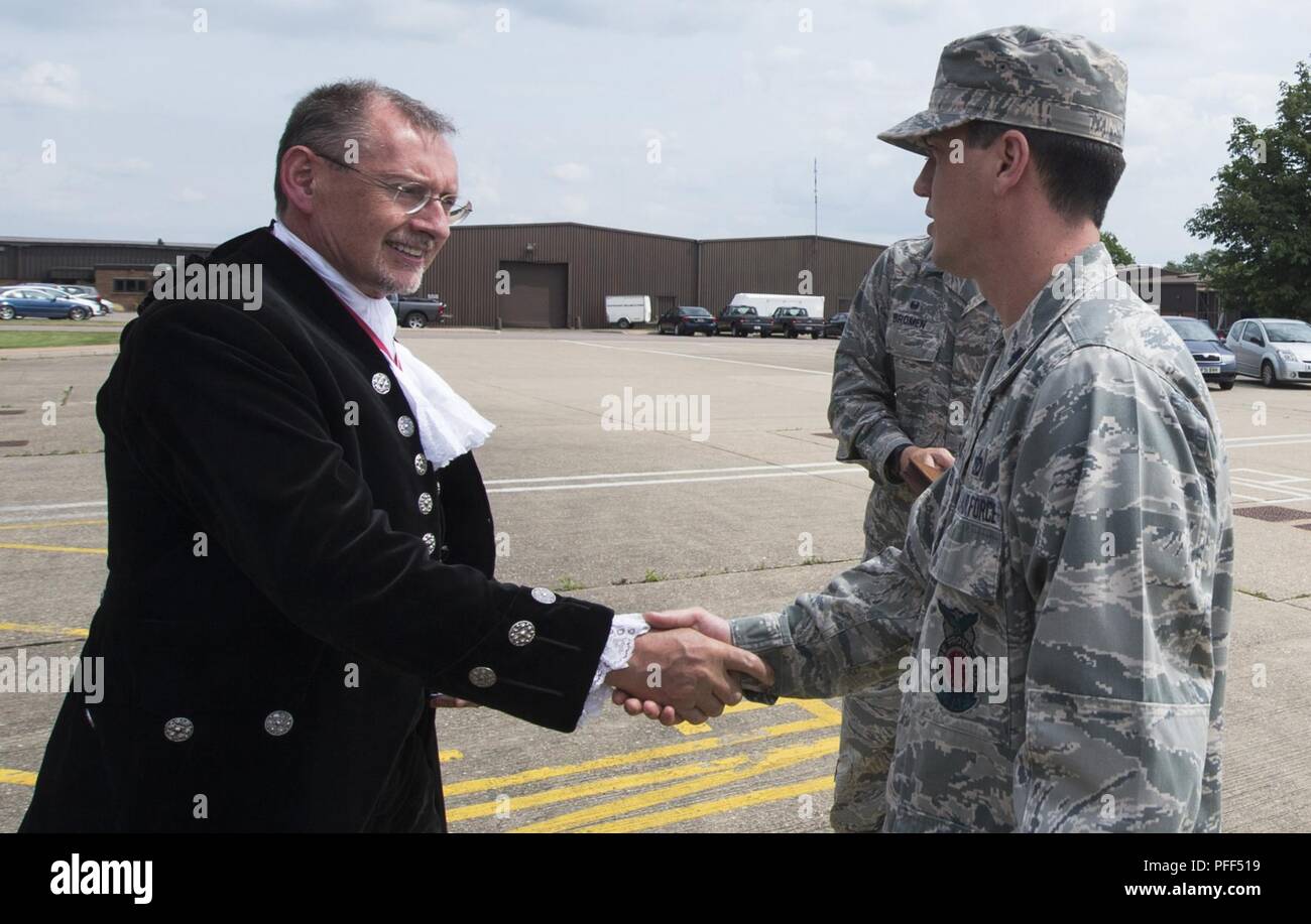 U.S. Air Force Lt. Col. Vincent Rea (right), 423rd Civil Engineering  Squadron Commander, greets Dr. Andy Harter (left), High Sheriff of  Cambridgeshire, during a base tour of RAF Alconbury, United Kingdom on