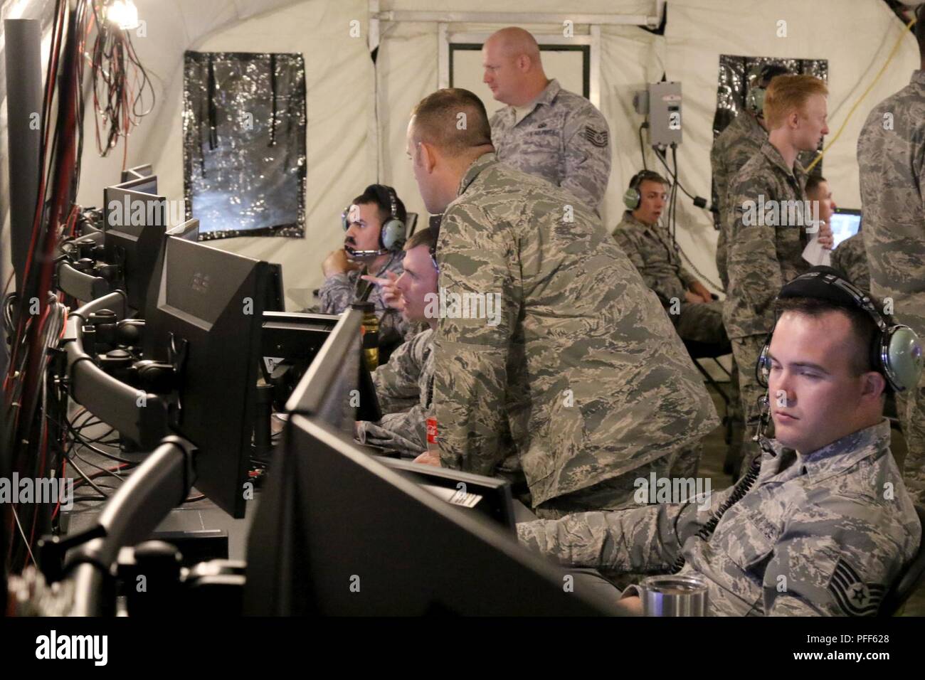 Airmen with the Wisconsin National Guard’s 128th Air Control Squadron train on the AN/TYQ-23A Tactical Air Operations Module (TAOM) command and control platform at Volk Field, Wis., June 13. The TAOM replaced the decades-old AN/TYQ-23 modular control equipment (MCE) operations module, providing the 128th ACS with increased capabilities as they conduct missions. Wisconsin National Guard Stock Photo