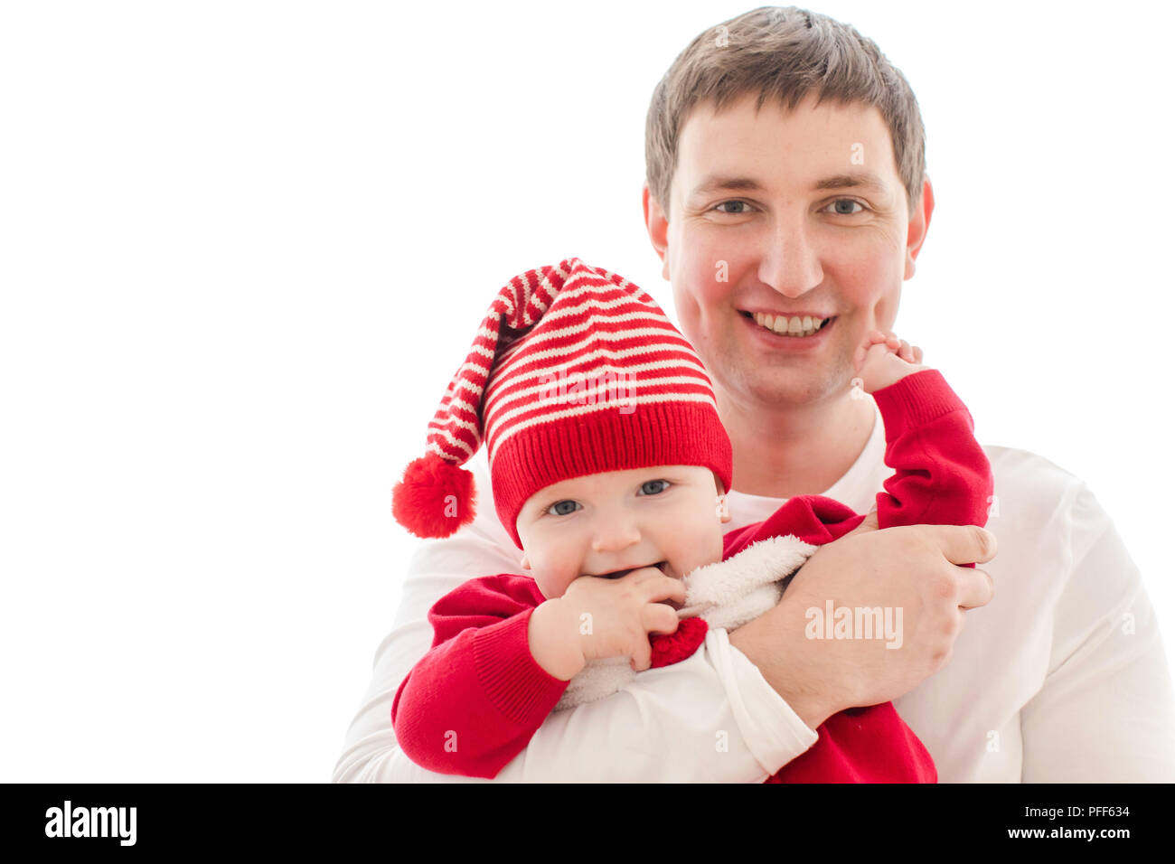 Man holding baby in Christmas costume Stock Photo