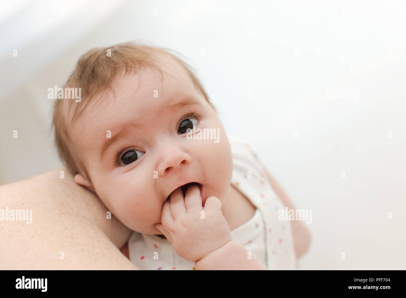Lovely baby sucking hand Stock Photo