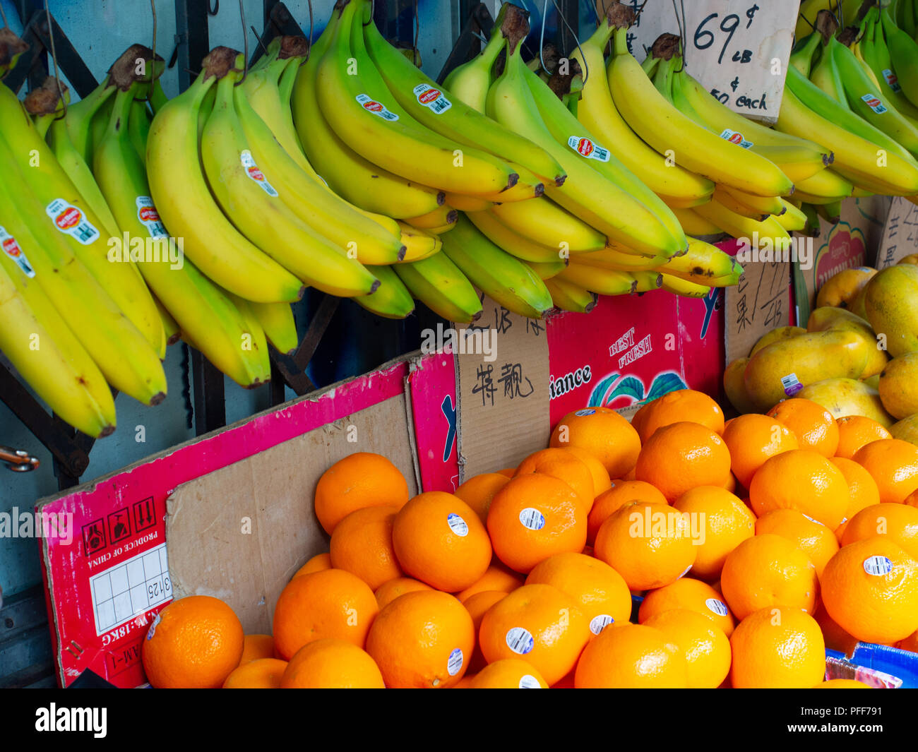 Oranges And Bananas For Sale At A Fruit Shop Stock Photo Alamy