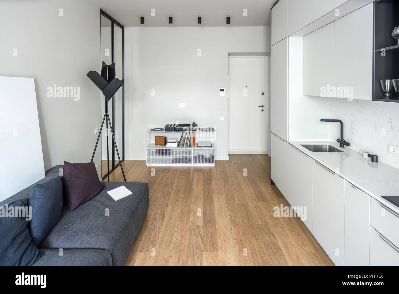 Trendy Kitchen In A Modern Style With Light Walls And A Parquet On