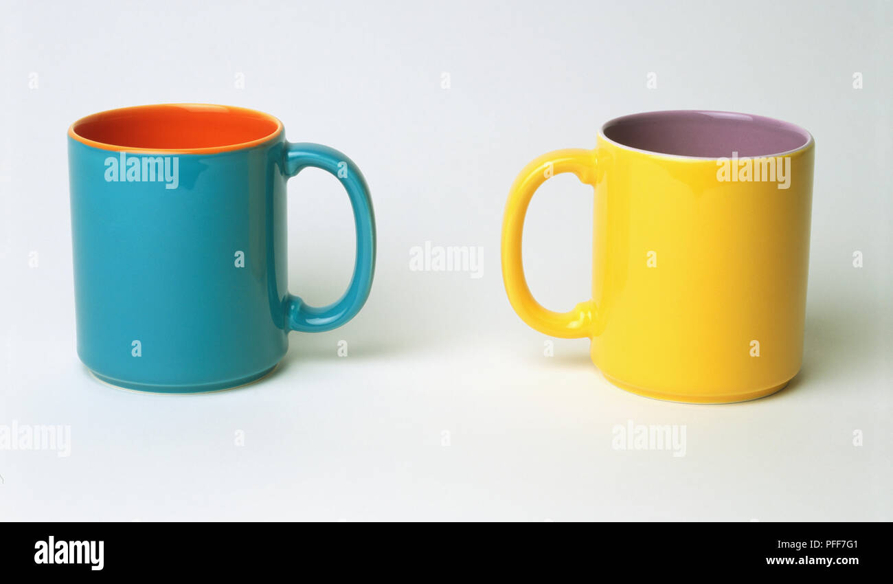 Two mugs with handles facing each other Stock Photo Alamy