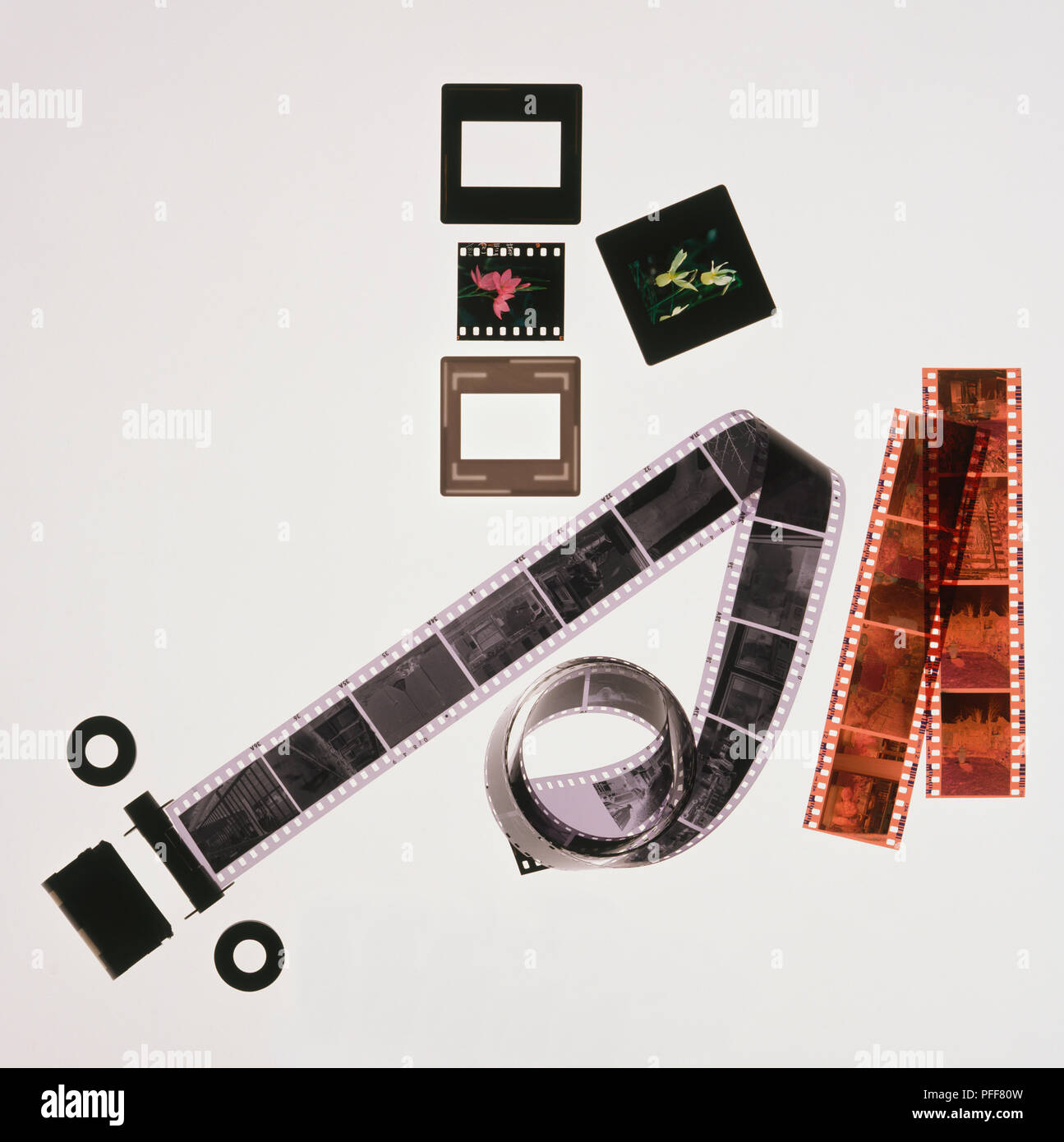 Roll of black and white negative film, strips of coloured negative film