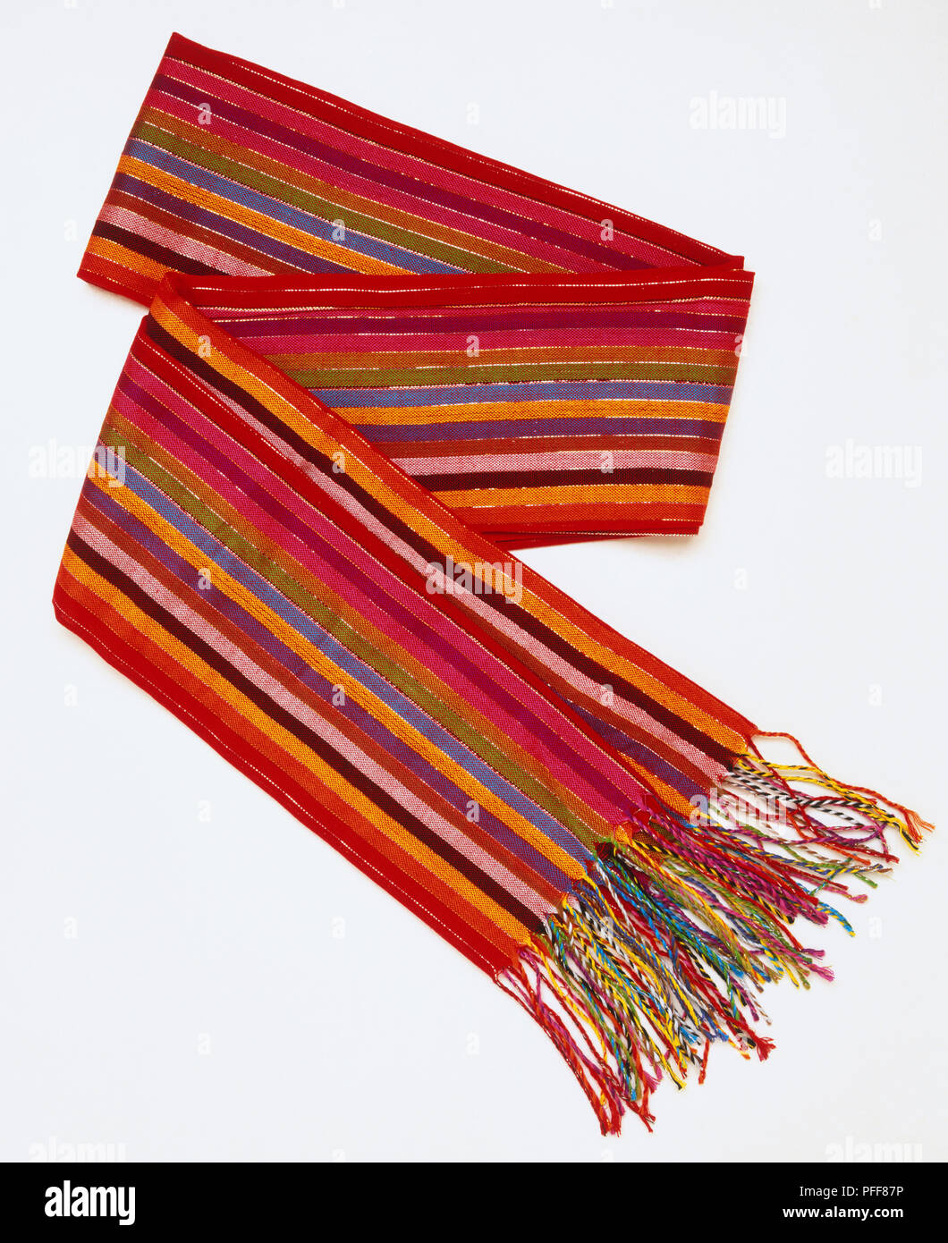 Colourful striped scarf with tassels, close up. Stock Photo