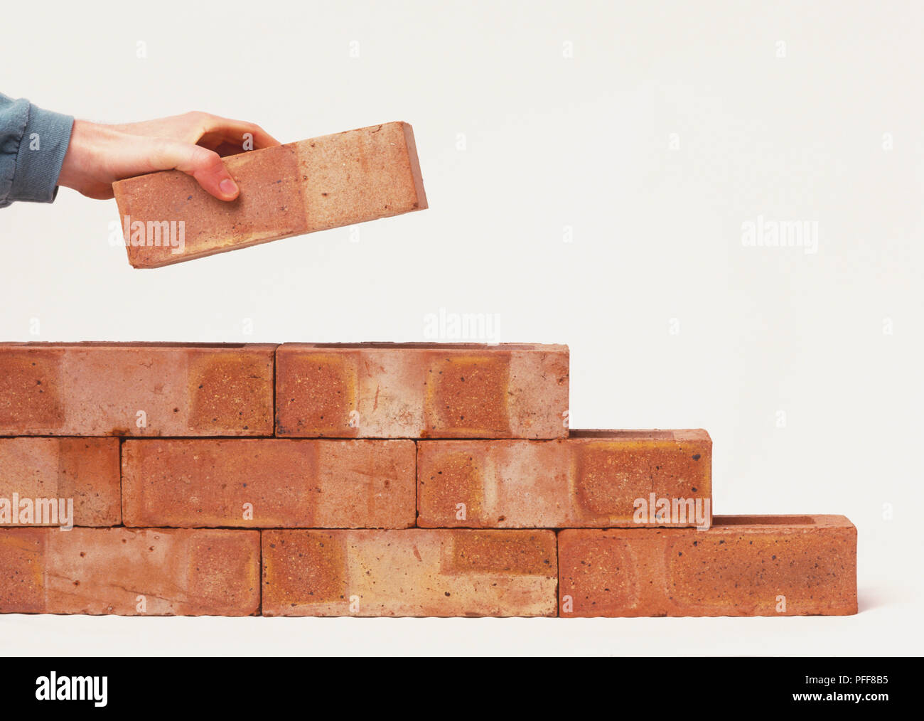 Laying bricks Stock Photo