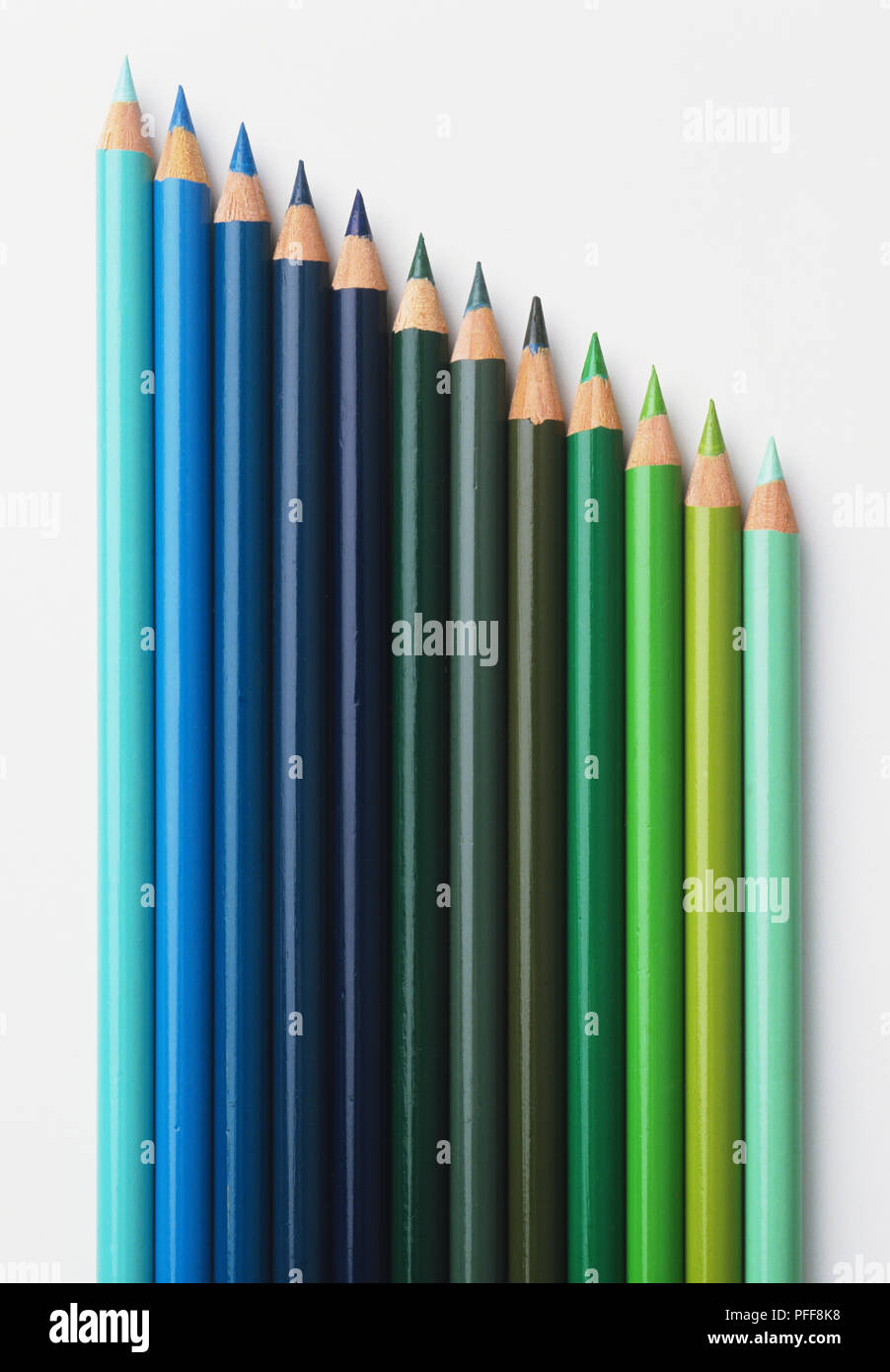 Array of coloured pencils, in shades of blue and green Stock Photo
