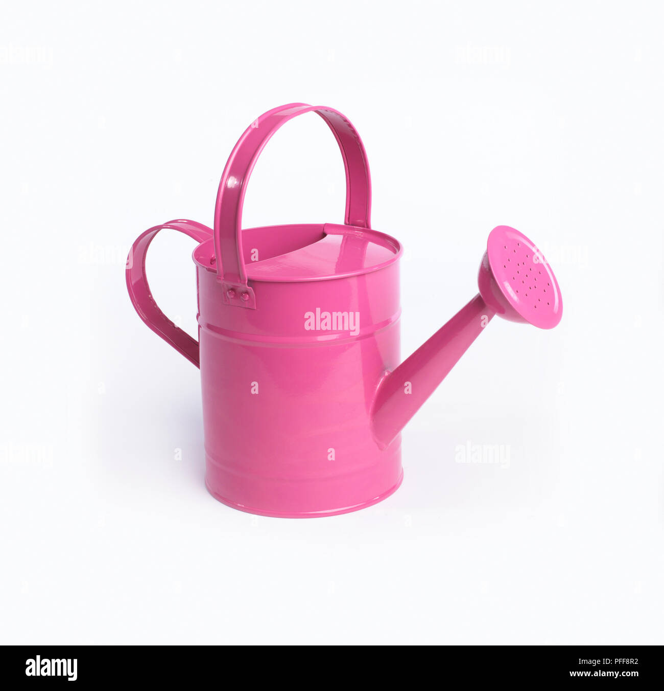 Pink metal watering can, closeup Stock Photo Alamy