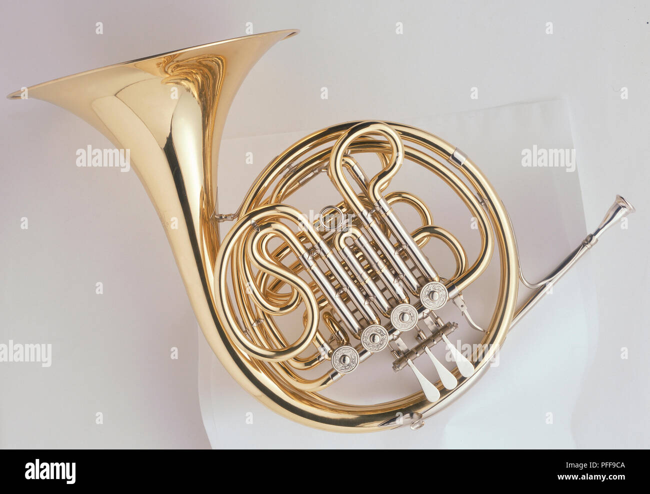 French Horn with large, flared bell, left view. Stock Photo
