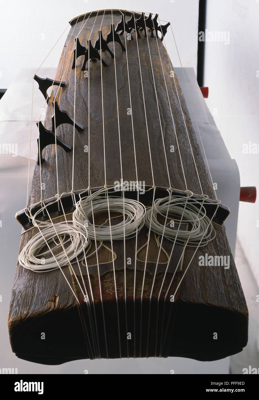 Koto with rectuangular wooden body and 13 strings, foreshortened view. Stock Photo