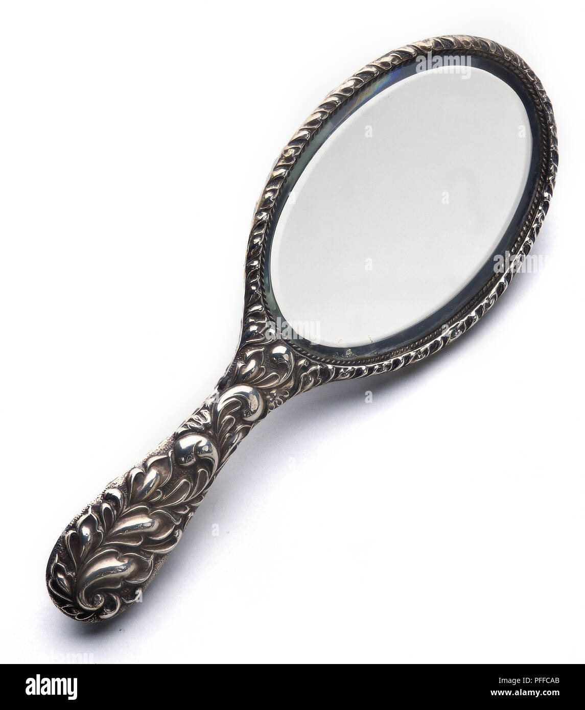 Silver ornate hand mirror. Stock Photo