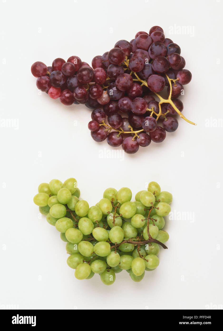 A bunch of red grapes and a bunch of green grapes Stock Photo