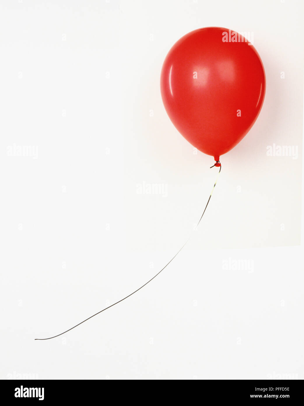 Red balloon on silver string Stock Photo - Alamy