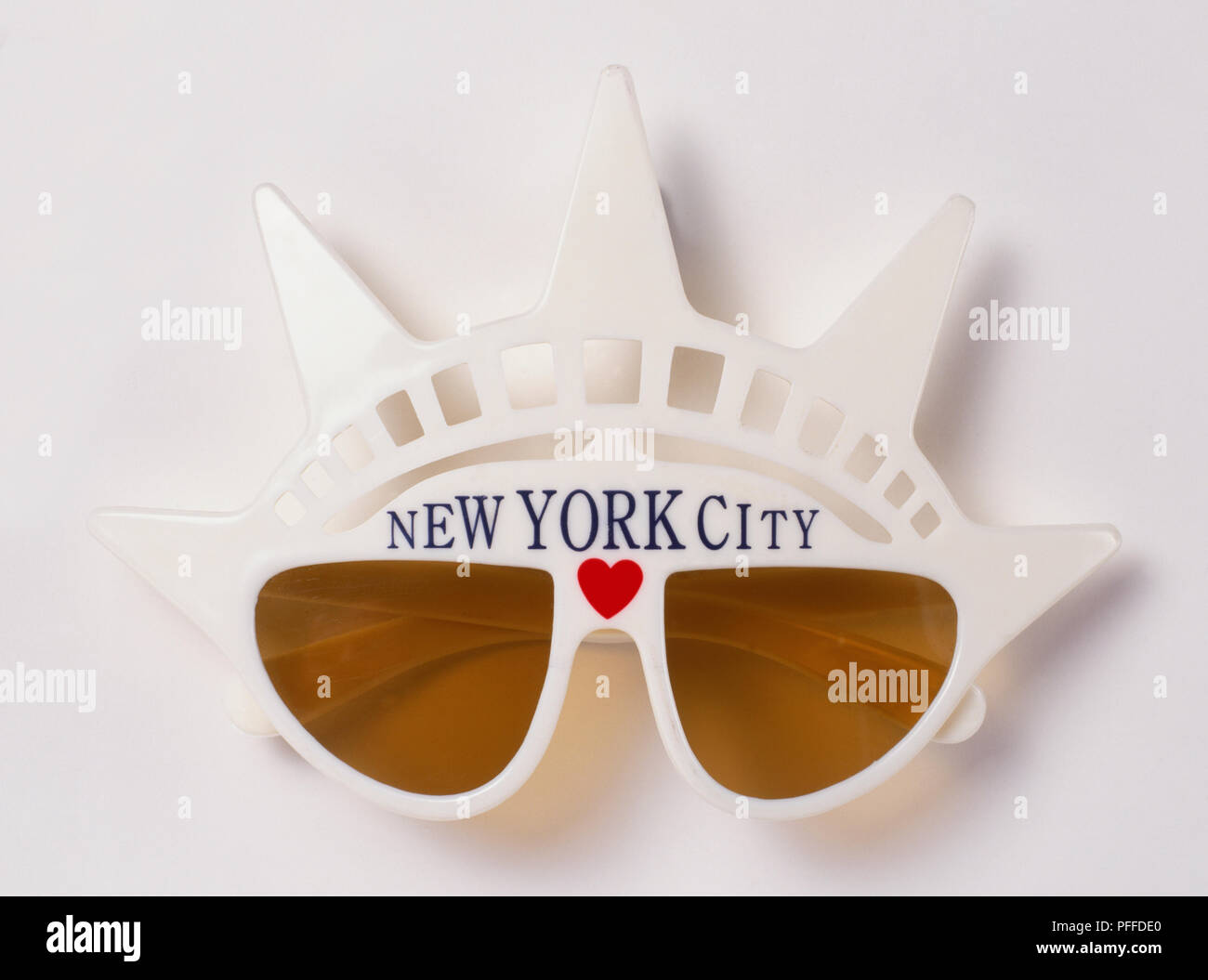 USA, New York City, sunglasses framed with plastic spikes shaped like Statue of Liberty crown and 'New York City' written across top. Stock Photo