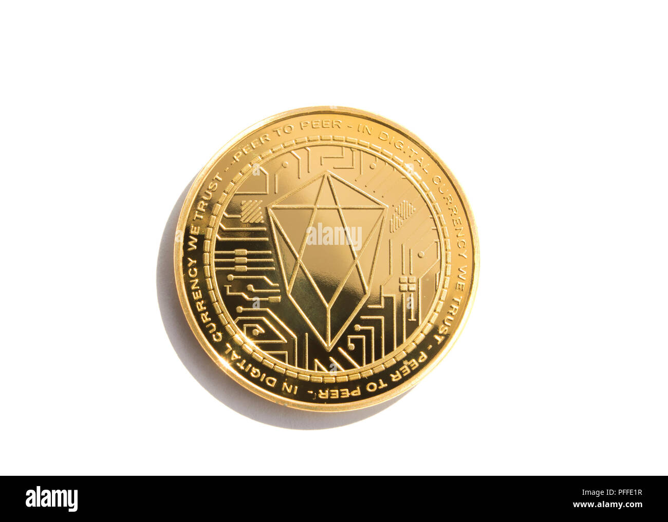 On a white background is isolated gold coin of a digital crypto  currency - eos with free space for text. The back side of the gold coin eos. Stock Photo