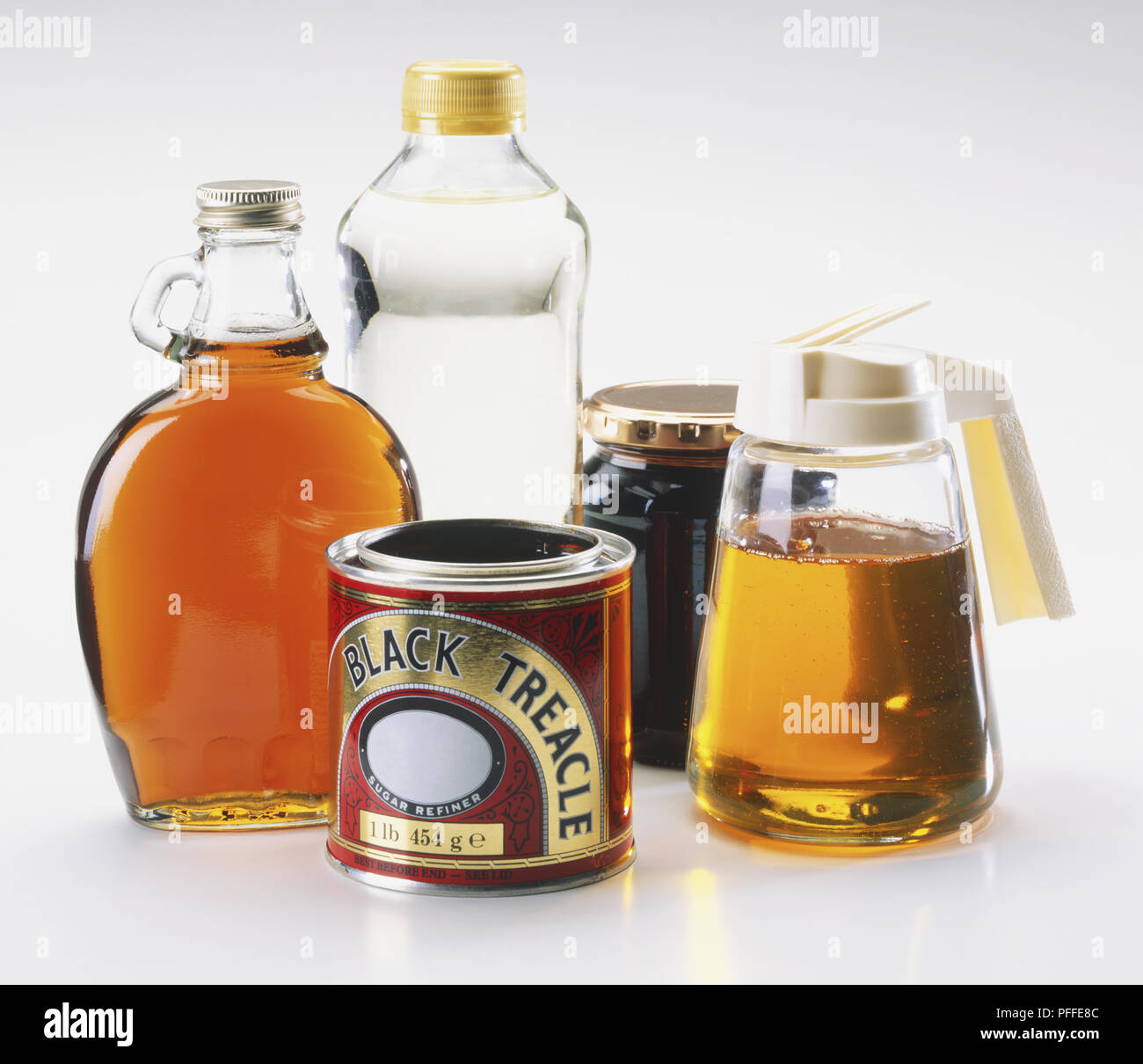 Bottles of maple syrup, corn syrup, molasses, golden syrup and black