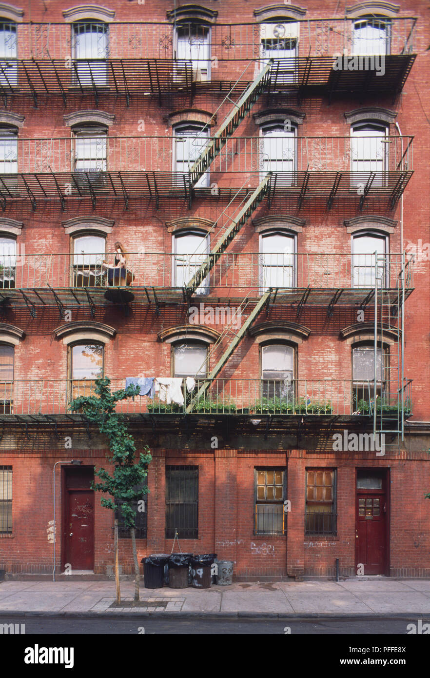 USA, New York, Manhattan, Lower East Side, facade of red-brick tenement block with external staircases. Stock Photo