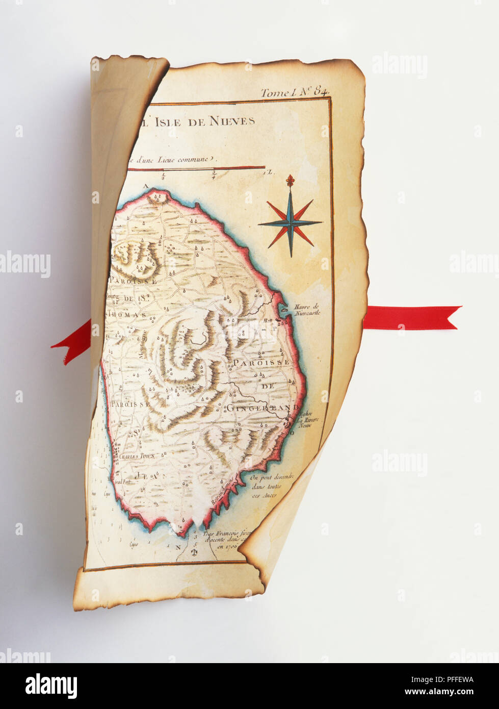 Antique map in a scroll with red ribbon. Stock Photo