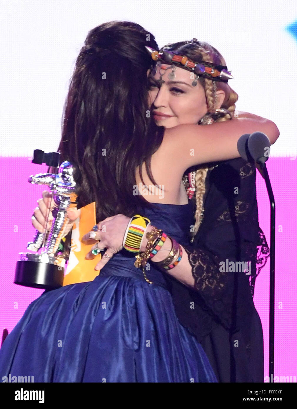 Camila Cabello (left) accepts the award for Video of the Year from Madonna on stage at the 2018 MTV Video Music Awards held at Radio City Music Hall in Los Angeles, USA. Picture date: Monday August 20, 2018. See PA Story SHOWBIZ VMAs. Photo credit should read: PA/PA Wire on stage at the 2018 MTV Video Music Awards held at The Forum in Los Angeles, USA. Picture date: Monday August 20, 2018. See PA Story SHOWBIZ VMAs. Photo credit should read: PA/PA Wire Stock Photo