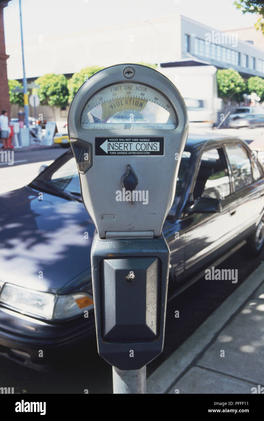 USA, California, San Francisco, close up of parking meter with parked car in background. Stock Photo