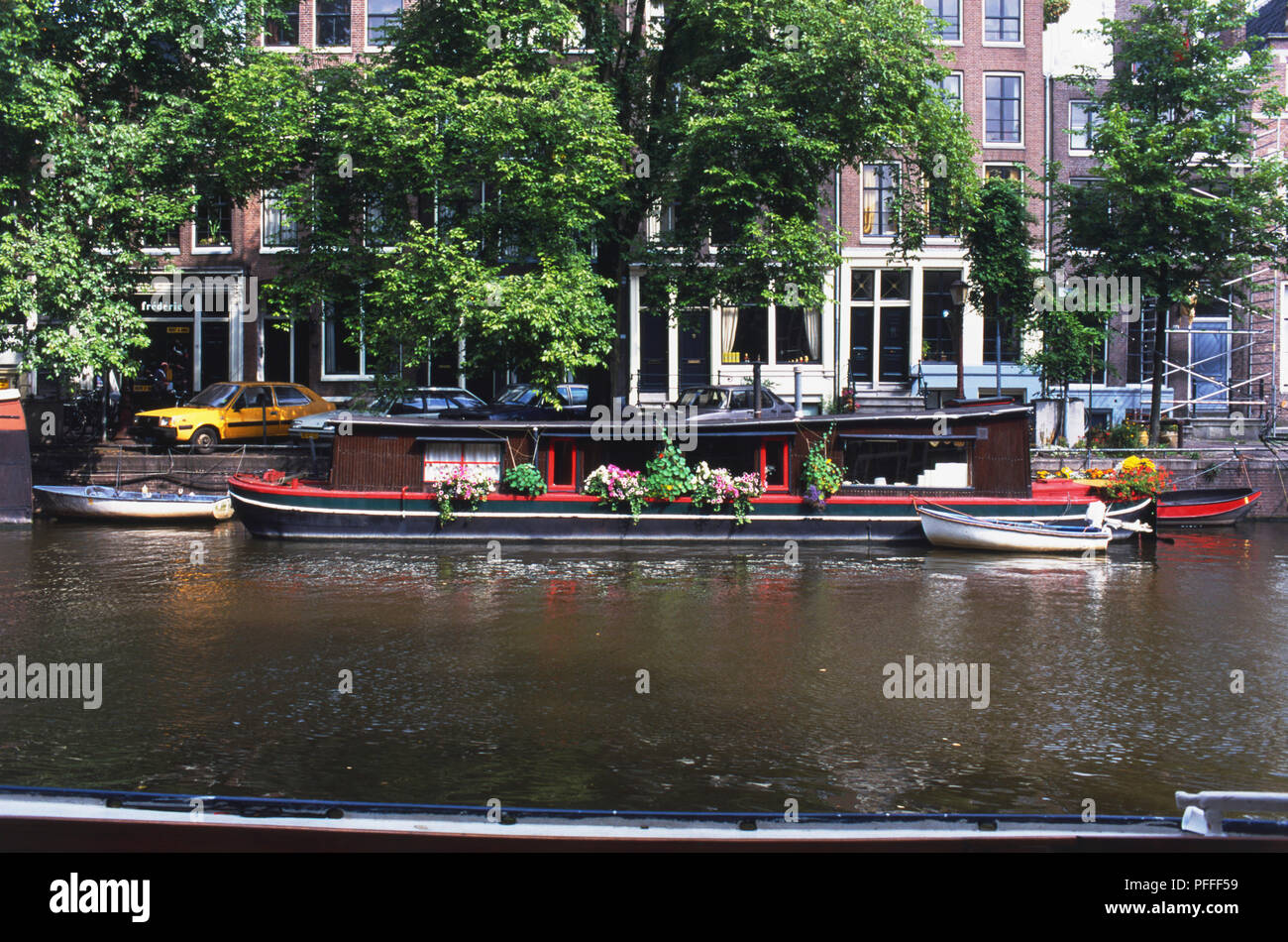 Holland, Amsterdam, flower filled house boat on Brouwersgracht Canal. Stock Photo